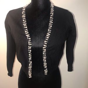 3/4 sleeve  with pearled trimmings.